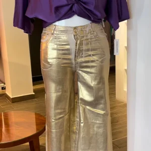 Jeans flare con foil efecto dorado